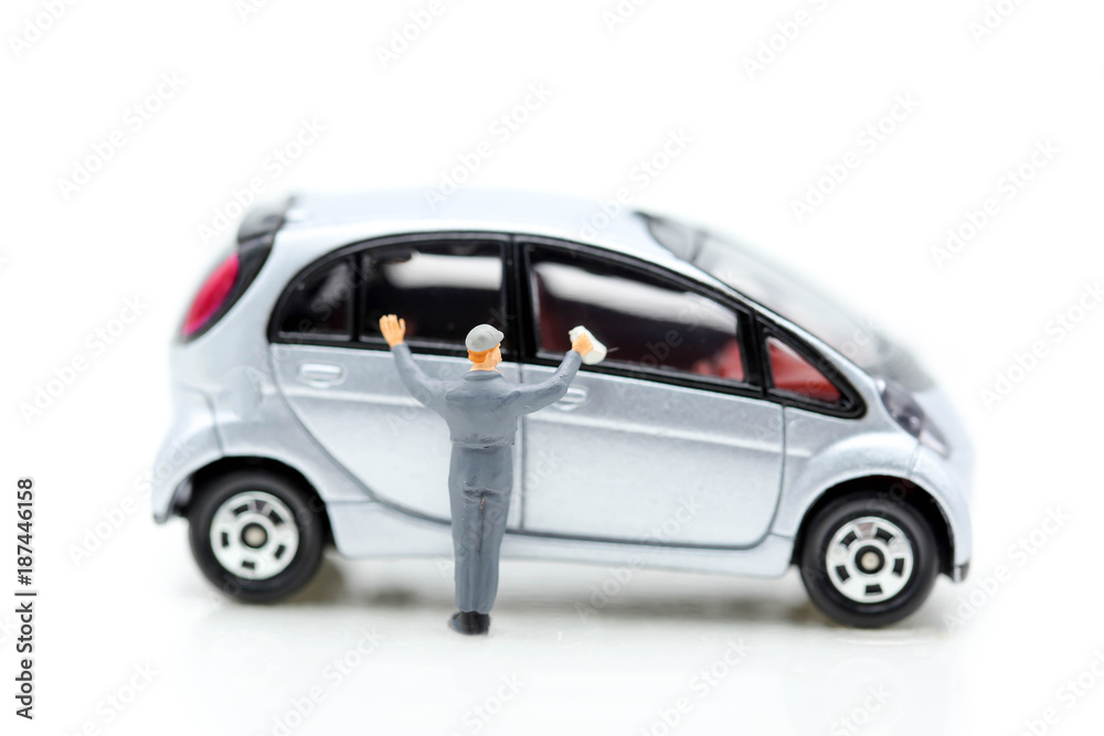 Miniature people: Worker cleaning car using as background business concept.