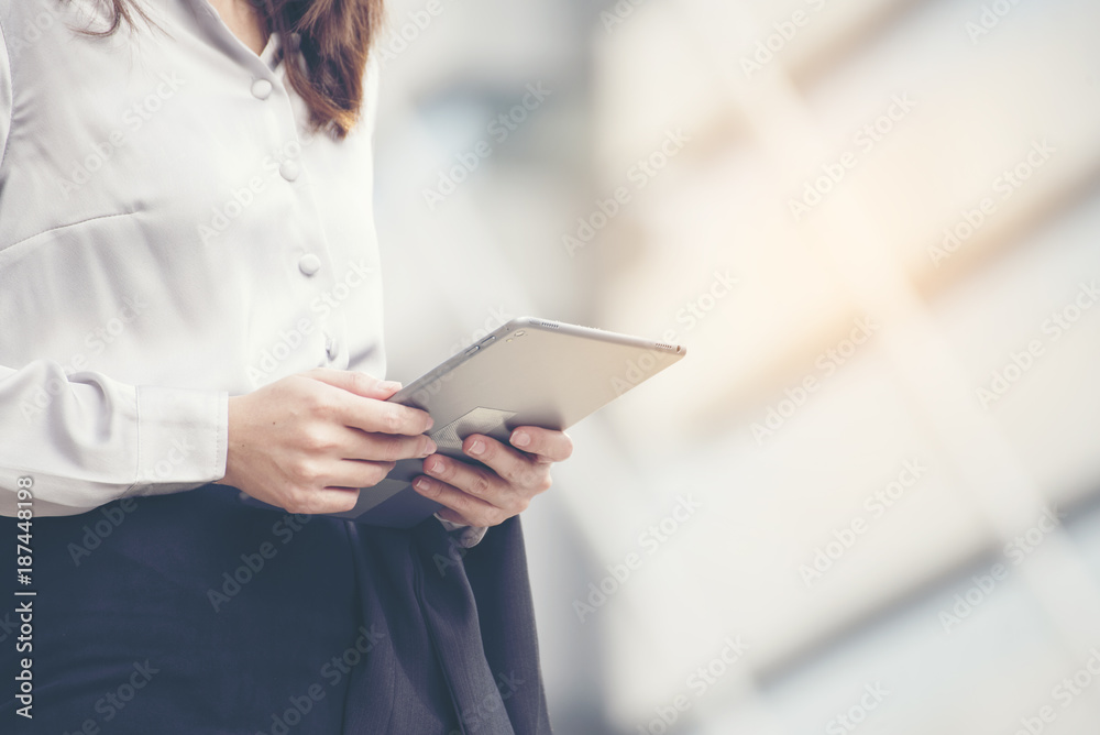 Young beautiful working woman holding smart tablet. Business technology concept. Young beautiful working woman holding smart tablet. Business technology concept.