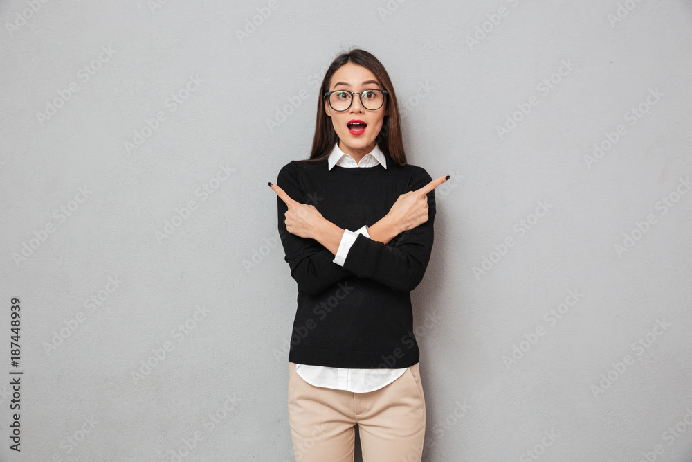 Surprised asian woman in business clothes and eyeglasses Surprised asian woman in business clothes and eyeglasses