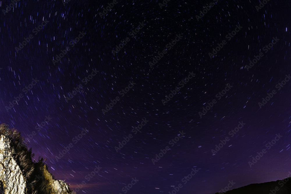 Star trails in the sky over the mountain