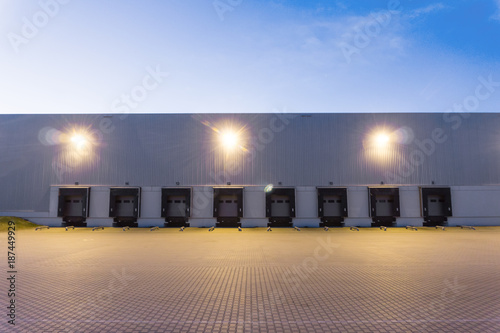 a large warehouse exterior with gates for dispatching goods