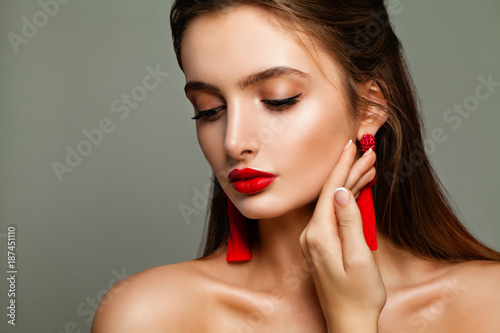 Nice Model Woman with Makeup and Beads Earrings. Female Face Closeup