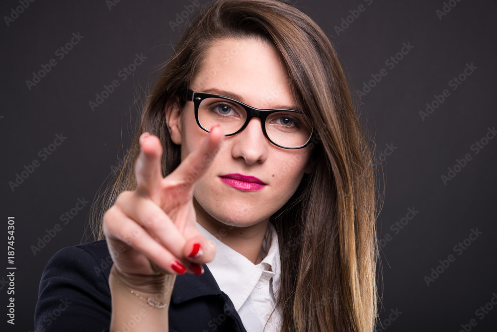Serious business woman is keeping eyes on you