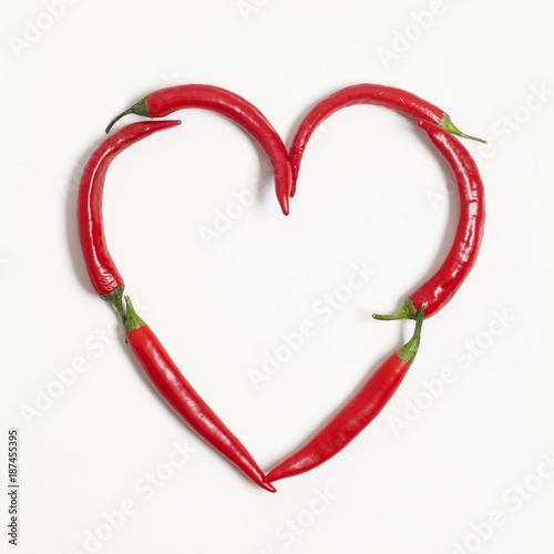 Red chili peppers arranged to make a heart shape