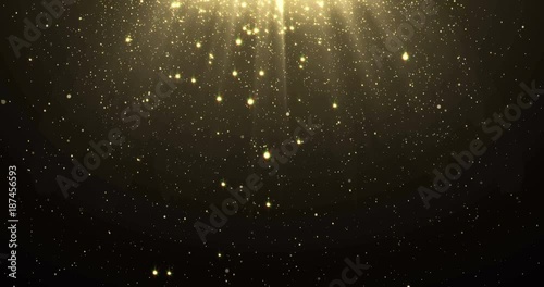 Abstract gold glitter particles background with shining stars falling down and light flare or glare overlay effect above for luxury premium product design or award template backdrop. Magic radiance