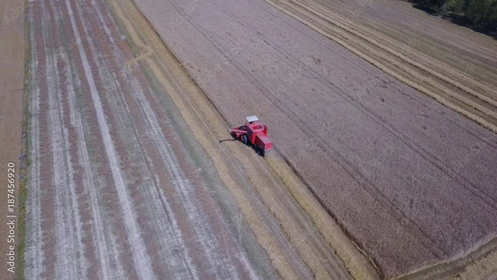 Aerial view on a tractor at harvest time Aerial view on a tractor at harvest time