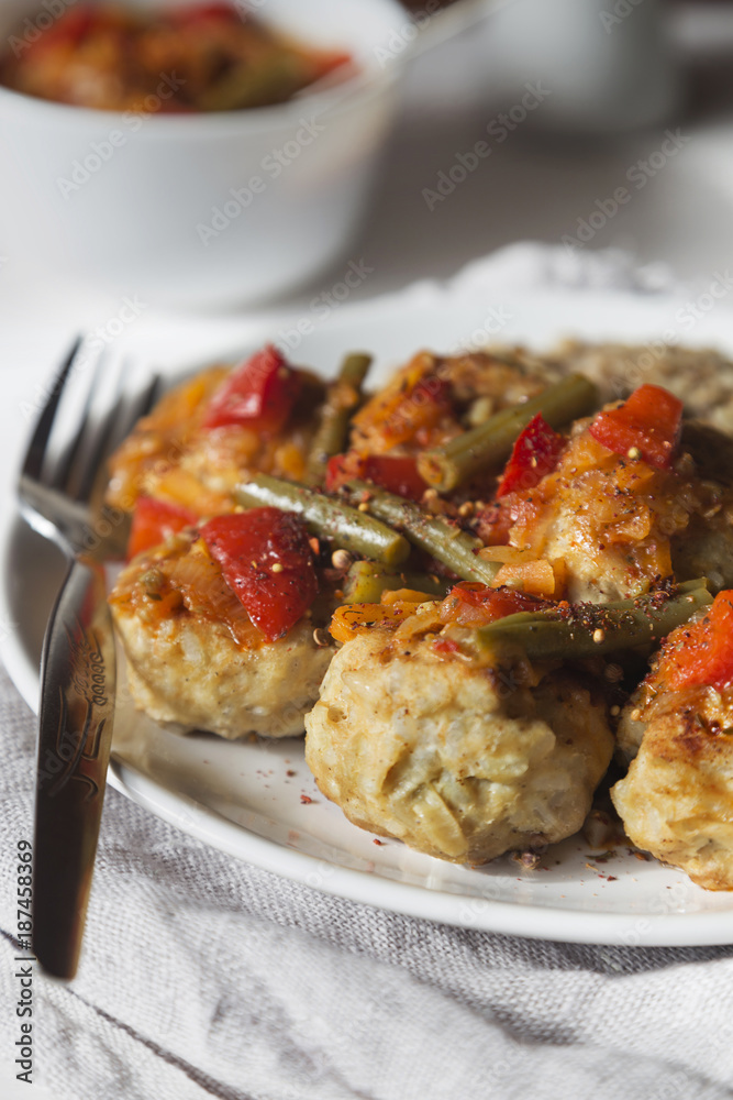 Meatballs with vegetable sauce and buckwheat