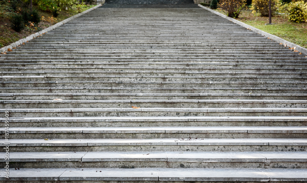 Fototapeta premium Old, majestic, grand, granite stone staircase leading up texture.