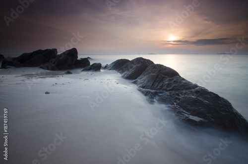Sunset at Ujung gelam beach, karimun jawa island, central java, indonesia photo