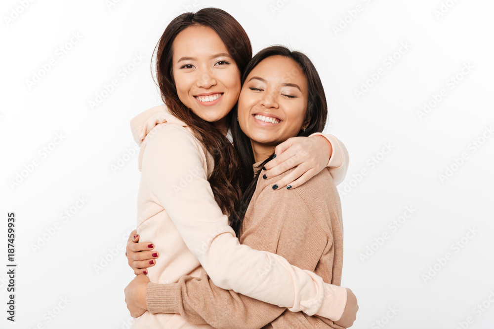 Two asian pretty cheerful ladies Two asian pretty cheerful ladies