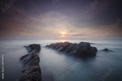 Sunset at Ujung gelam beach, karimun jawa island, central java, indonesia photo