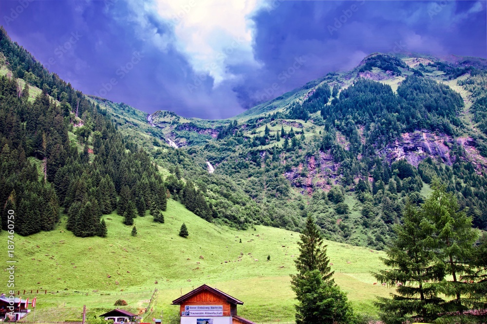 distant hills after a storm under a dark blue brooding sky at K‰ferertal, Austria