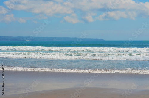 Sea view from tropical beach with sunny sky. Summer paradise beach of Bali island.