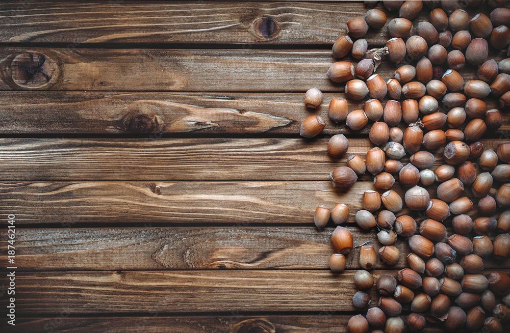 Hazelnut on a wooden background. Useful autumn food. Snacks. Copy space. Hazelnut on a wooden background. Useful autumn food. Snacks. Copy space.