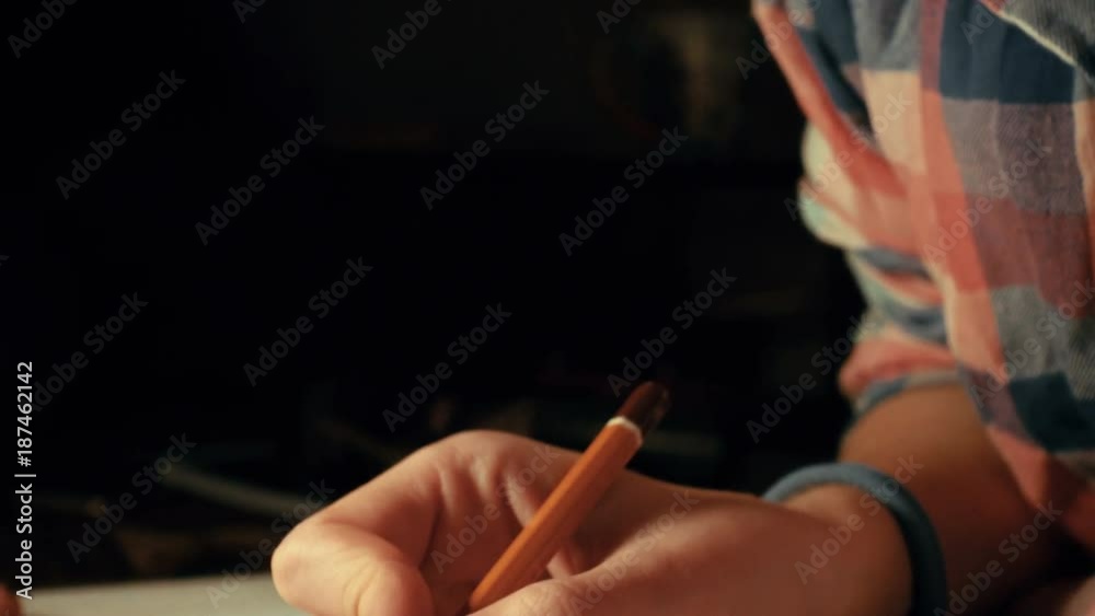 girl drawing a sketch with the pencil at her notepad
girl drawing a sketch with the pencil at her notepad