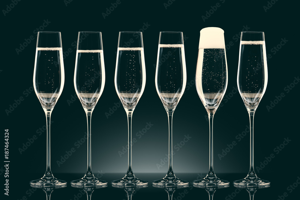 six transparent glasses with champagne on black six transparent glasses with champagne on black