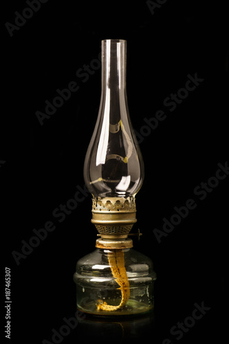 Old antique kerosene oil lantern lamp with vintage glass chimne