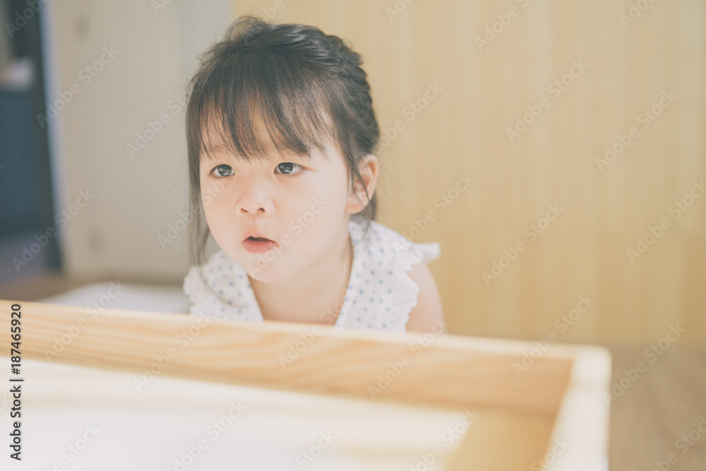 child girl happy look smart phone. asian child.Child development.Little asian girl look smart phone in living room child girl happy look smart phone. asian child.Child development.Little asian girl look smart phone in living room