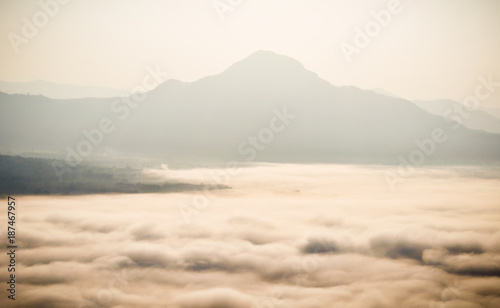 Early morning foggy sunrise on top of mountain soft focus. © tpap8228
