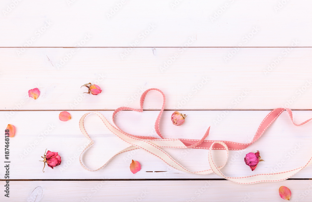 Two ribbon magic hearts on wooden backround, Valentine day concept Two ribbon magic hearts on wooden backround, Valentine day concept