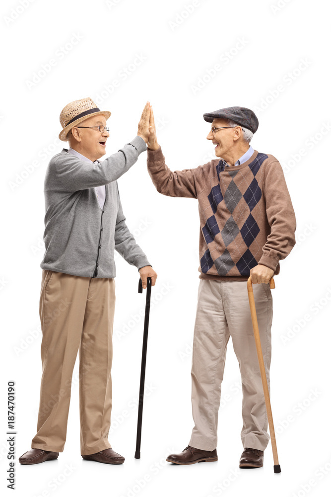 Two elderly men high-fiving each other