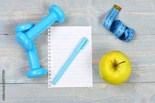 Blank page and gym equipment in cyan blue, top view