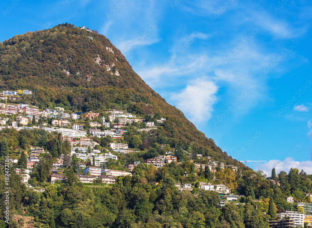 Summit of the Monte Bre mountain, building on the slope of the mountain - view from the city of Lugano in the Swiss canton of Ticino in autumn