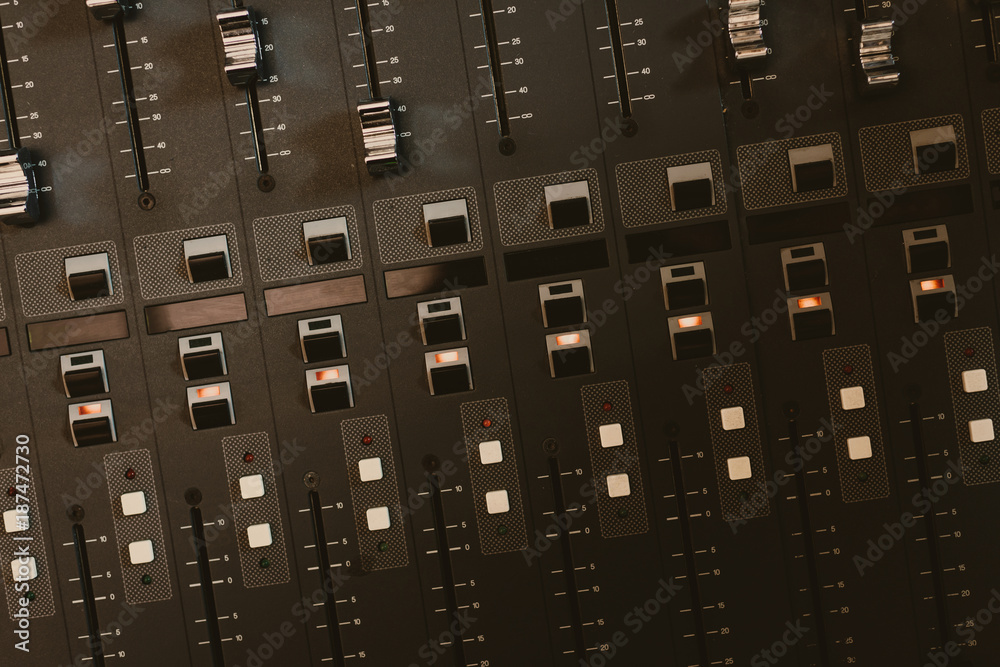 top view of analog graphic equalizer at recording studio