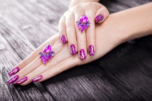 Shattered glass purple manicure on black background