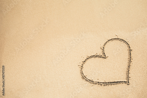 Heart written on the sand photo