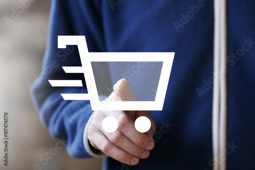 Businessman push button shopping cart icon