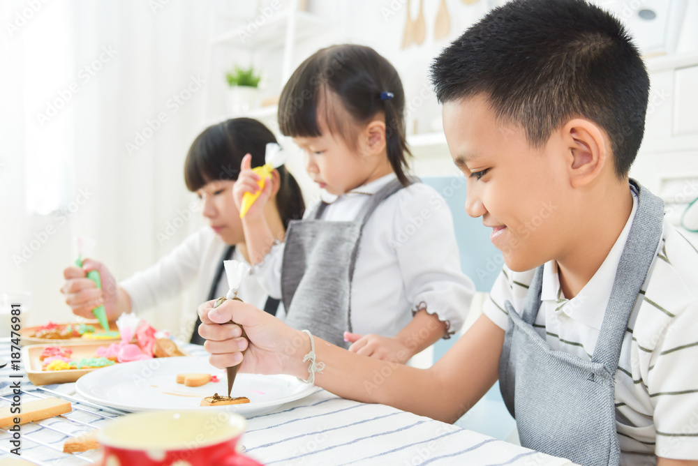 Kids decorating cookies. Kids decorating cookies.