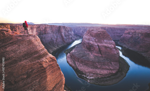 Obraz na płótnie Hiker overlooking Horseshoe Bend at sunset, Arizona, USA w salonie