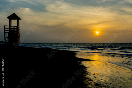 The sun sets at Kotu beach in The Gambia