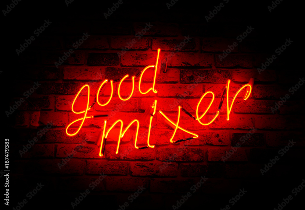 Red neon sign good mixer text on brick wall. Red neon sign good mixer text on brick wall.