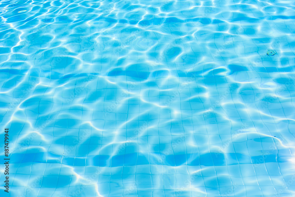 Obraz premium Water abstract background, Swimming pool rippled.Under water tile of swimming pool floor.