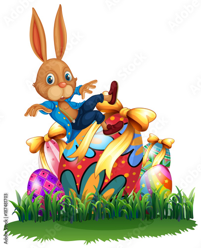 Cute bunny and easter eggs in garden