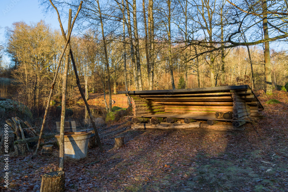 Camp site in forest area with fireplace and sheltered sleepover accommodation. The river Braknean in southern Sweden is visible in the background. Camp site in forest area with fireplace and sheltered sleepover accommodation. The river Braknean in southern Sweden is visible in the background.