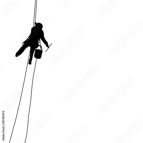 Silhouette of industrial climber washes windows on a white background