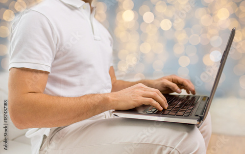 close up of man typing on laptop keyboard