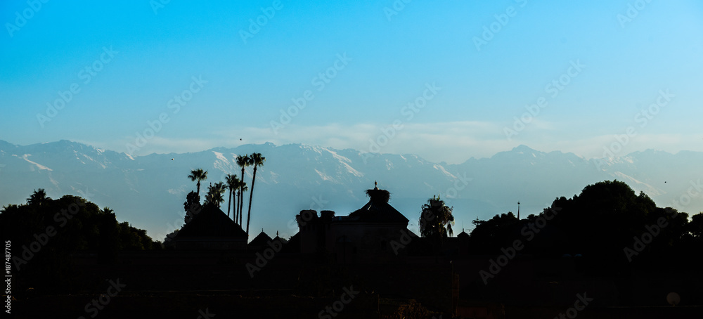 Obraz premium Silhouette of the Medina of Marrakech with the Atlas mountains in the background, Morocco