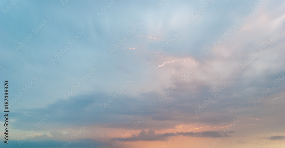 bright white lightning thundercloud purple pink blue clouds in the evening sky clouds storm rain