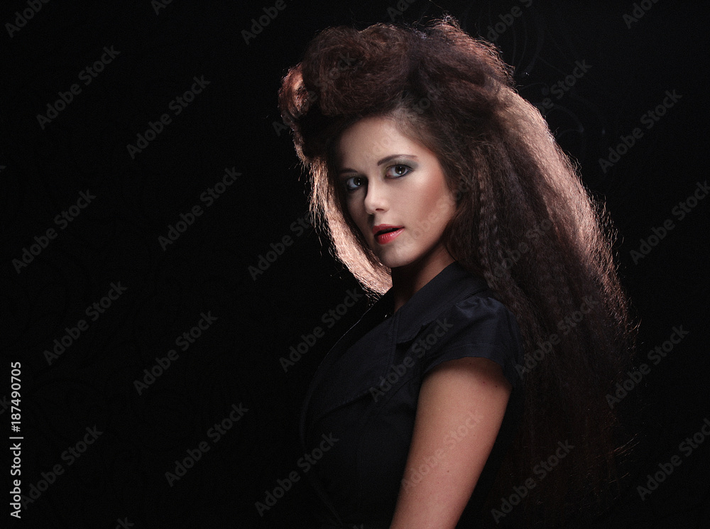 Beautiful young woman with magnificent hairdo