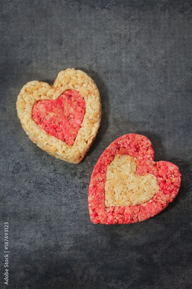 Fototapeta premium Homemade Rice Crispy hearts with copy space / valentines day food top view