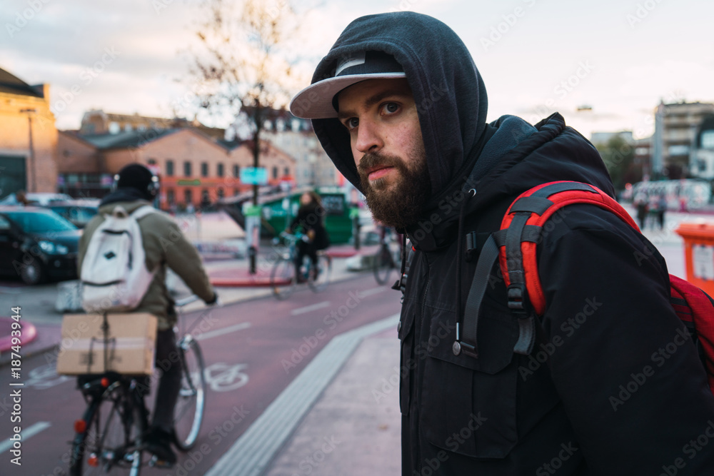 Bearded man standing on street Bearded man standing on street