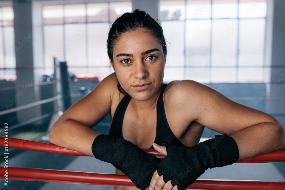 Fototapeta premium Female boxer inside a boxing ring