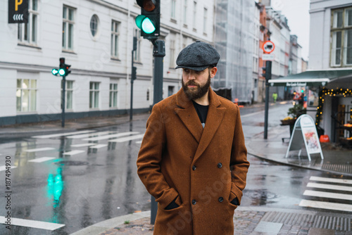 Bearded man standing on street photo