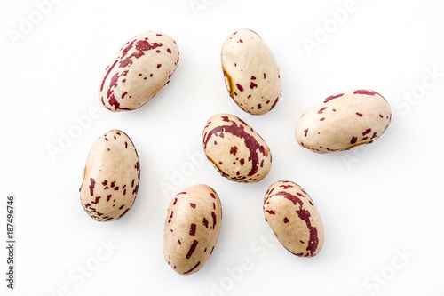 Raw pinto beans isolated on white background photo