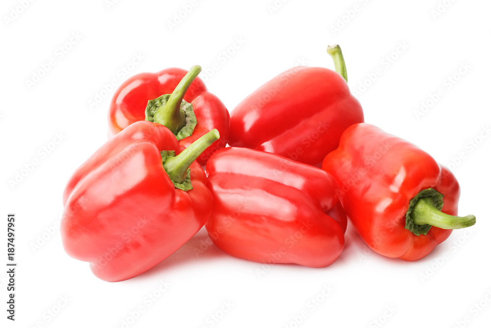 Five ripe red sweet peppers isolated on white