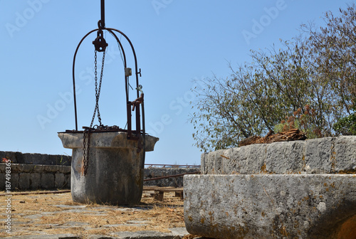 Ancient well on an abandoned property in a village on the Adriatic coast